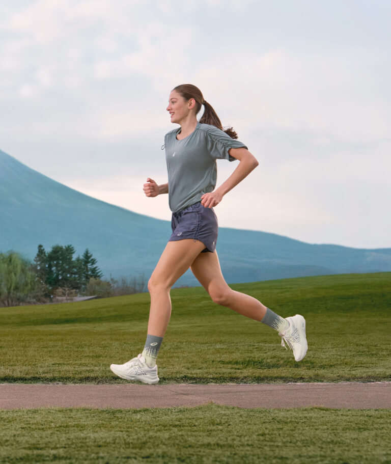Woman running in ASICS outlet new arrivals shoes