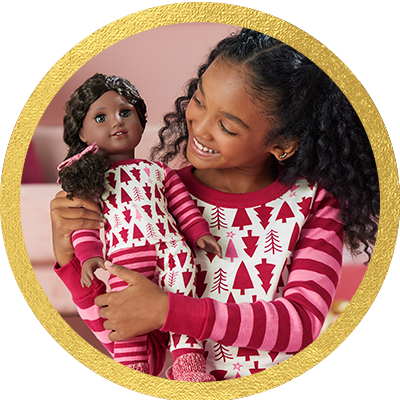 Girl playing with a Truly Me doll