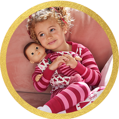 Little girl holding a Bitty Baby doll