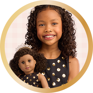 AG x J.Crew collab with girl holding doll in matching black polka dot dress