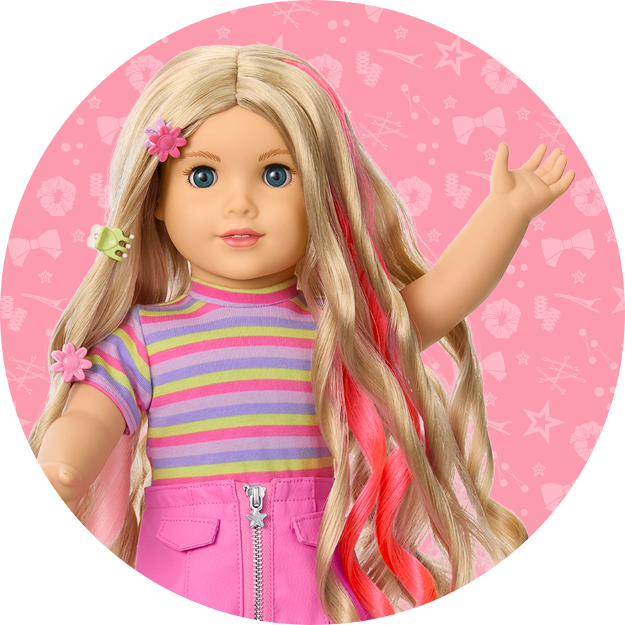 Doll in spring colors outfit with pink hair highlights and pink and yellow hairclips