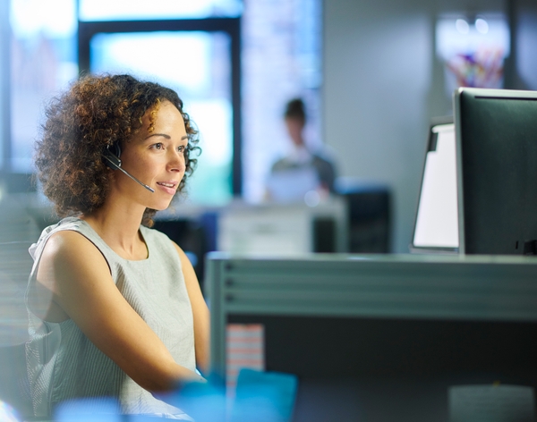 Female_call_center_worker_takes_a_call_052020.jpg