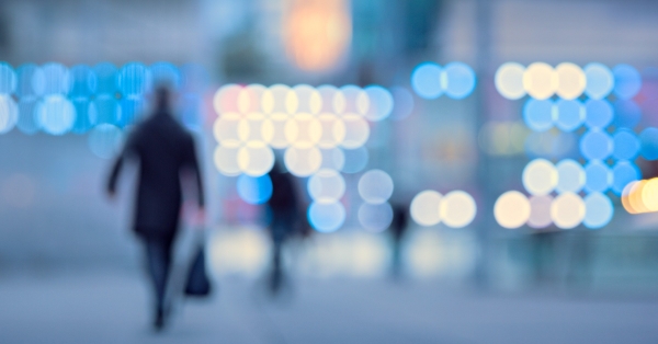 Blurred image of busy workforce walking down city streets