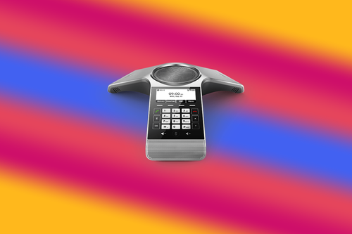 Image of a Yealink CP920 VoIP conference phone with a colorful background