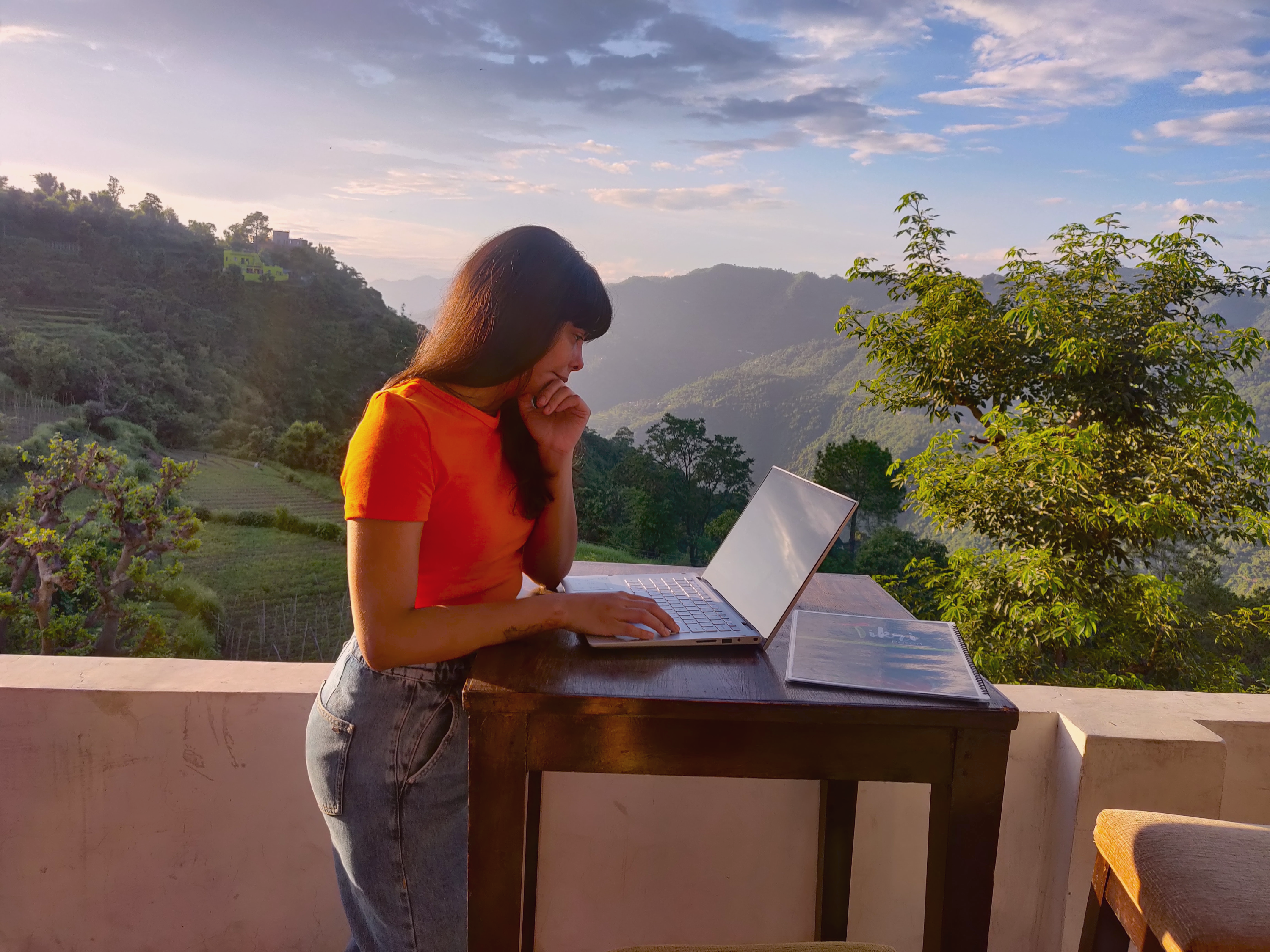 Woman working remotely with beautiful surroundings