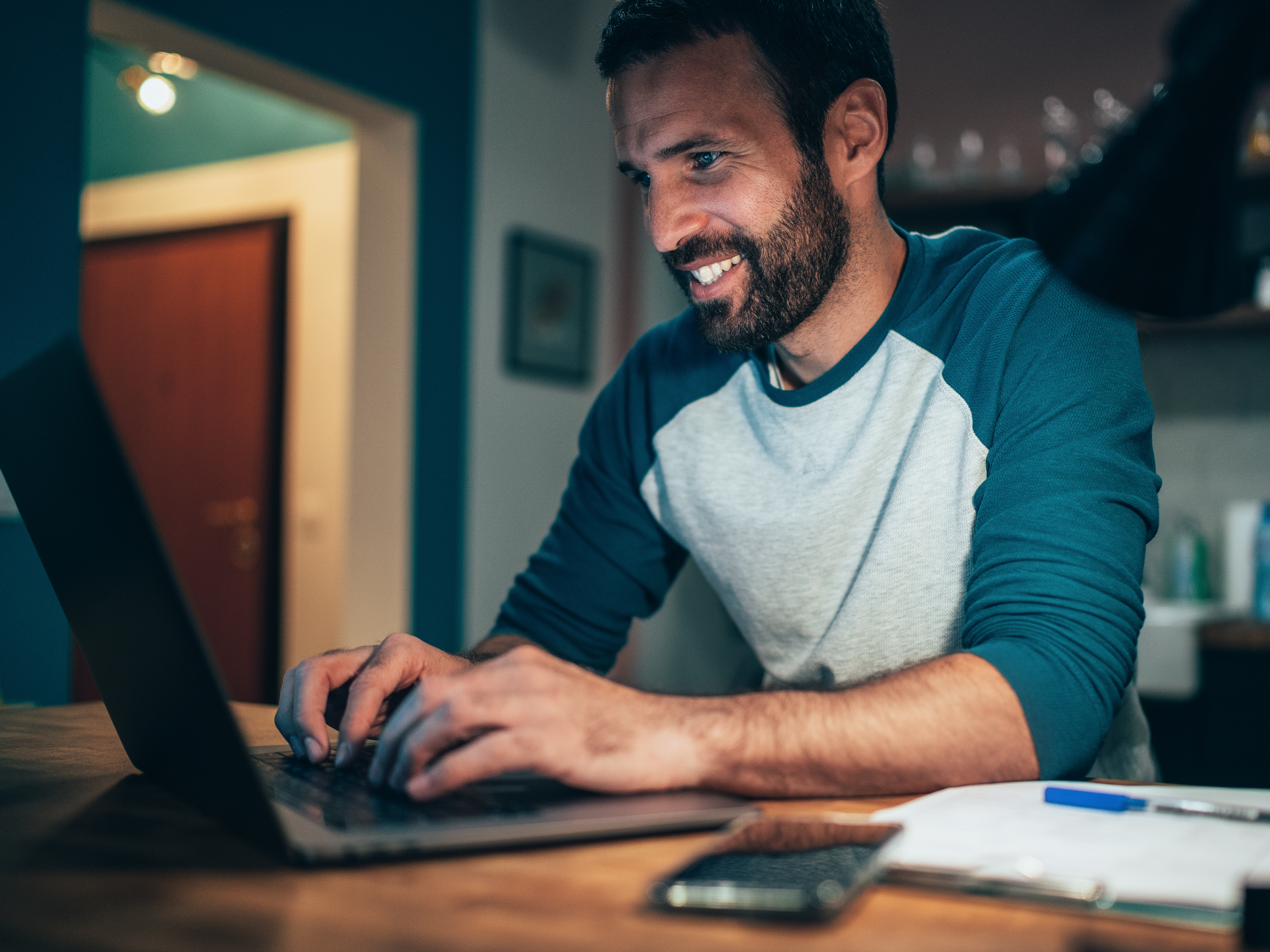 A man searching about 8x8’s partner’s program on his laptop to grow his agency business.