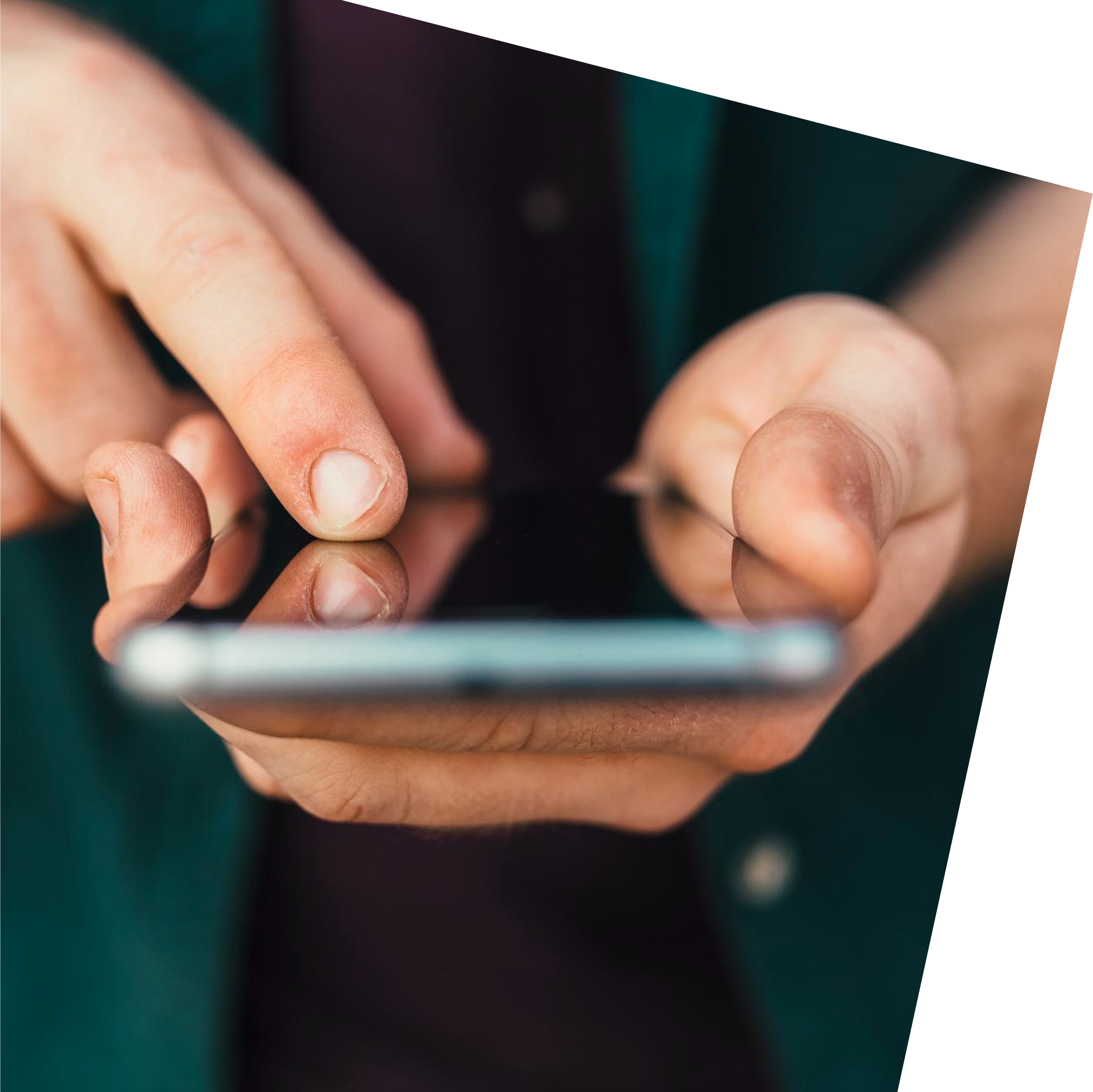 Close-up of hands holding a smartphone, with fingers tapping the screen. The image conveys focus and interaction with technology.