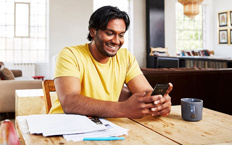 A person in their home preparing to start a phone interview. 