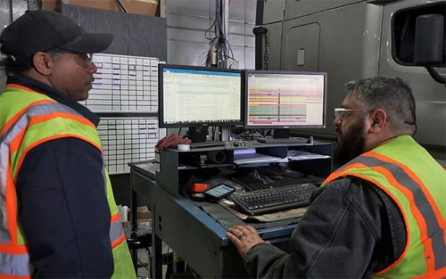 Two diesel technicians use technology to find a solution to a problem.