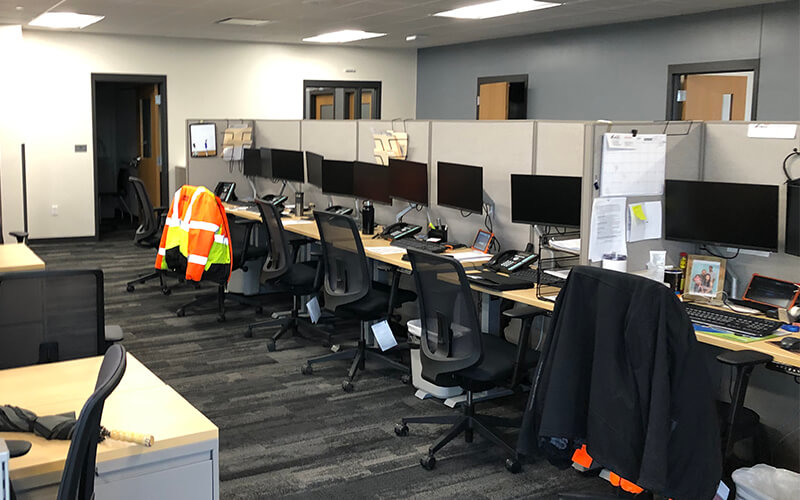 Computers sit ready for use by associates in the upgraded Dallas office space.