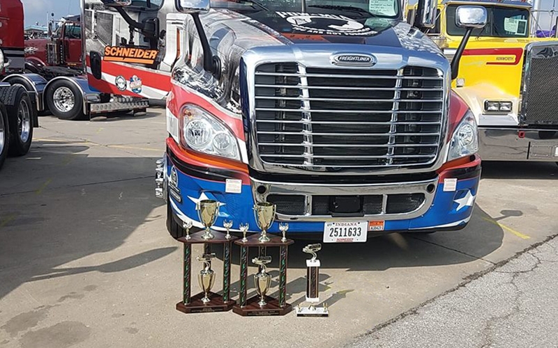 Schneider's 2018 Ride of Pride truck with Walcott trophies