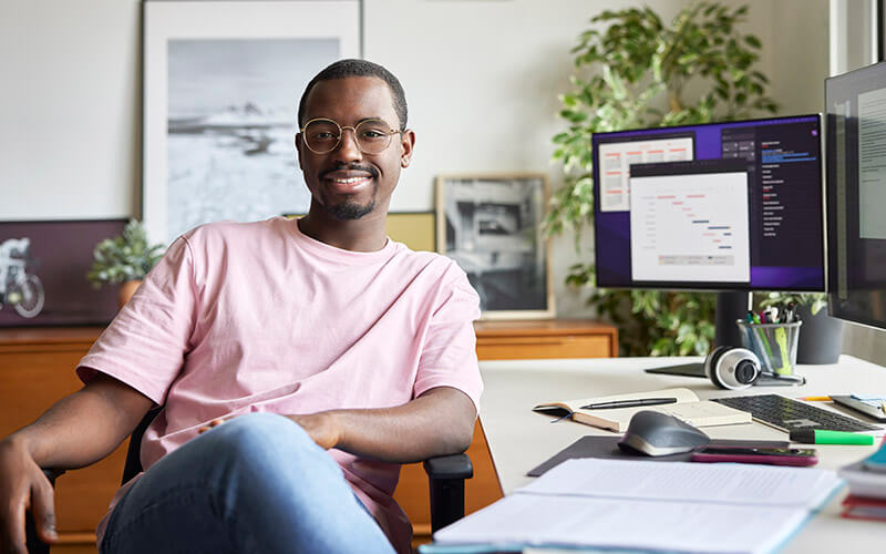 Man sitting at a desk.