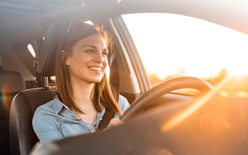 A woman driving in a car.