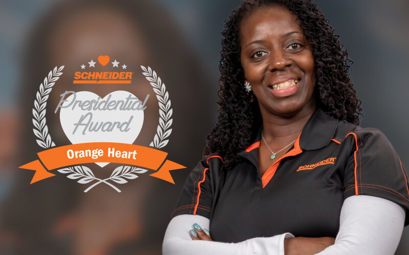 Schneider driver Latanya Smith poses after winning the Orange Heart Award.