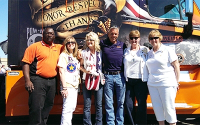 2013 Ride of Pride driver Chuck Ceccacci poses with fellow veterans in front of his Ride of Pride truck.