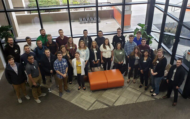 Schneider's summer interns gather in the lobby of the corporate headquarters.