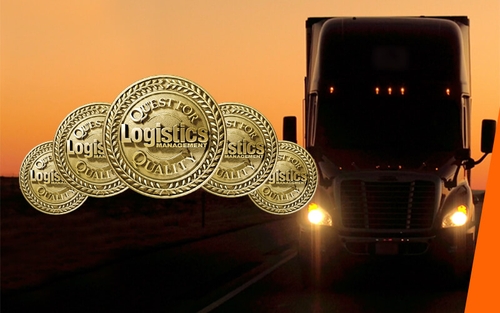Five gold badges representing Schneider's five Quest for Quality awards in front of a semi-truck in a sunset.