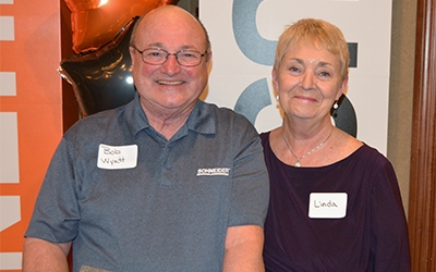 Linda stands with her husband Bob at a Schneider event.