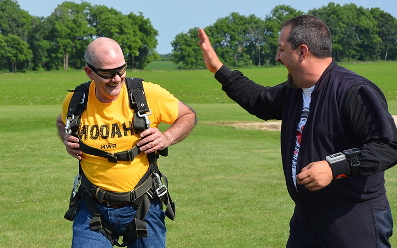 Jay's instructor offers a high-five shortly after landing.