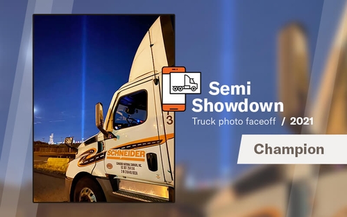 The winning Semi Showdown photo of a Schneider truck parked in front of the 9/11 memorial lights is displayed next to text that says "Semi Showdown truck photo faceoff, 2021 champion.