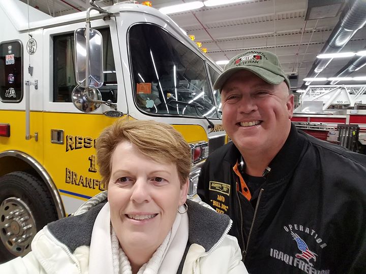 Gold Star mother Molly Morel and Schneider Ride of Pride driver David Price take a selfie together