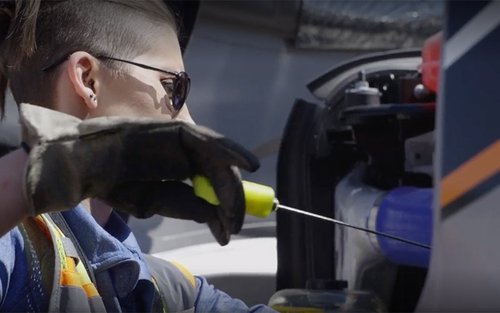 A truck driver completing their pre-trip description.