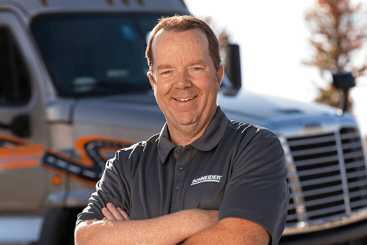 Schneider Over-the Road truck driver with company truck