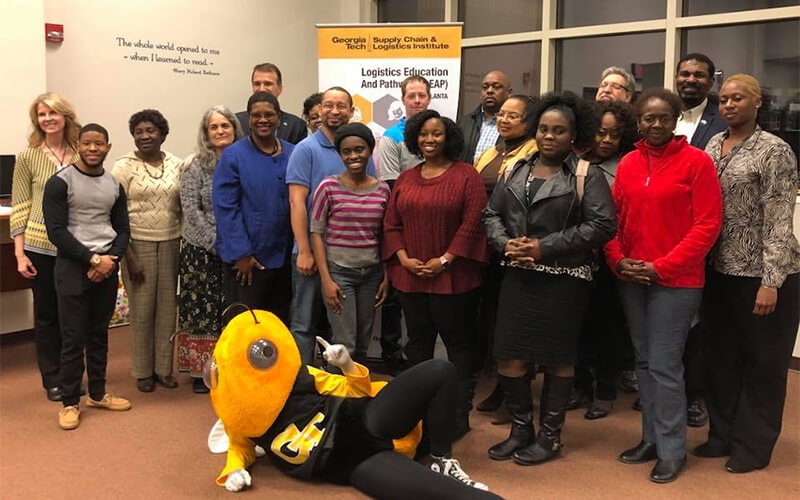 Georgia Tech LEAP students gather with their bee mascot "Buzz" at this year's graduation ceremony.