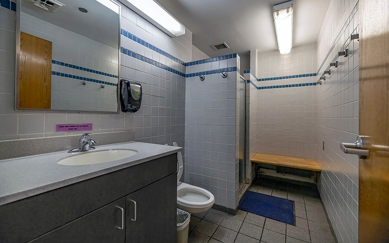 The inside of a shower stall at a truck stop.