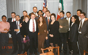 Todd Jadin poses with members of Schneider’s Mexico team during an event.
