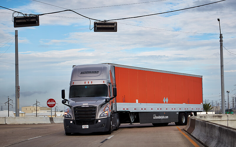 A Schneider associate demonstrates how to turn left in a tractor trailer.