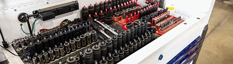 A large spread of tools that lay in the top drawer of a toolbox 