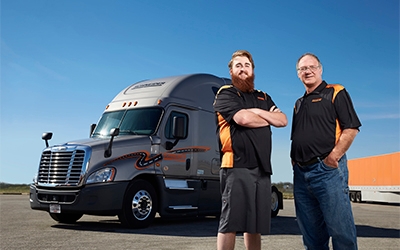Schneider team drivers Rick and Ricky Lograsso with their company truck