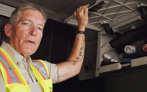 Schneider Driver Ambassador Wes Arnott giving a tour of the inside of his cab.