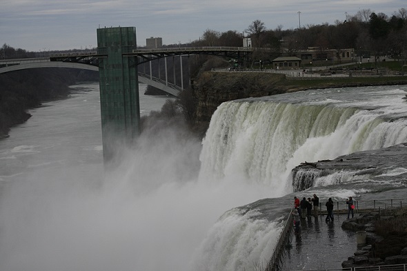 Mist rises from water dropping into Lake Ontario at Niagara Falls 