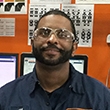 Headshot of Joseph at a Schneider facility