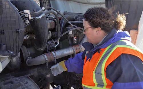 A truck driver completing their post-trip inspection.