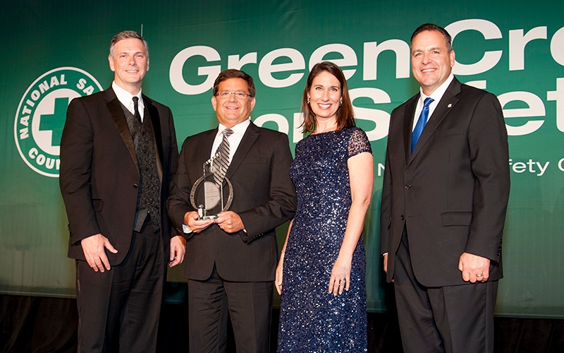 Members of the National Safety Council present Tom DiSalvi with the 2018 Green Cross Award. Tom accepts the award on behalf of Schneider.