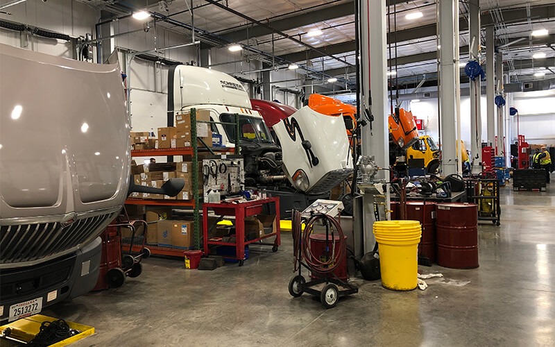 Dallas diesel technicians service company trucks in the expanded maintenance facility.