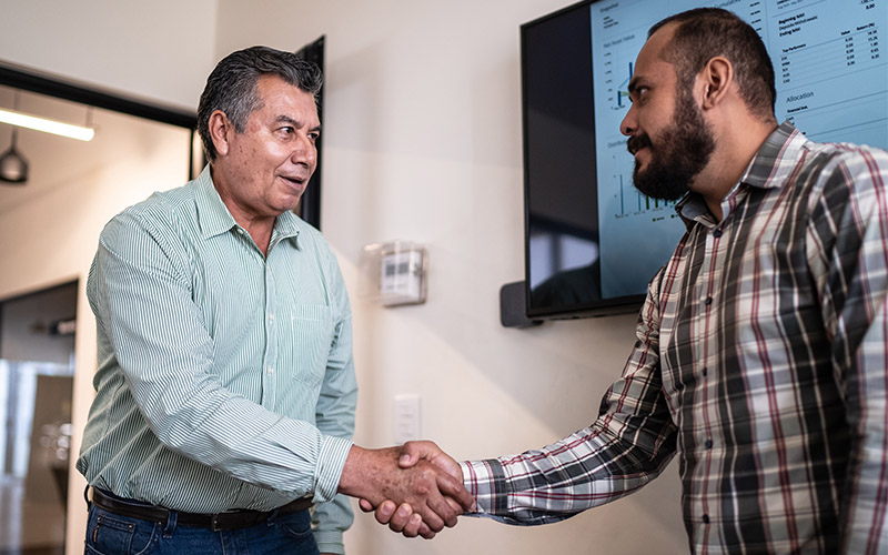 Two men shaking hands.