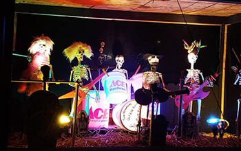 A band on the pirate ship made up of skeletons plays various instruments like guitars, drums,  base and more.