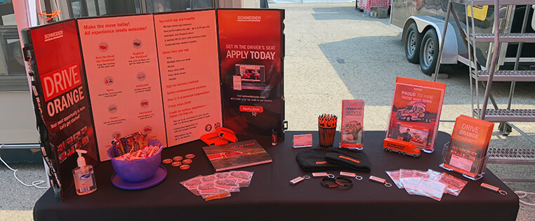Schneider recruiting booth with career information and company merchandise