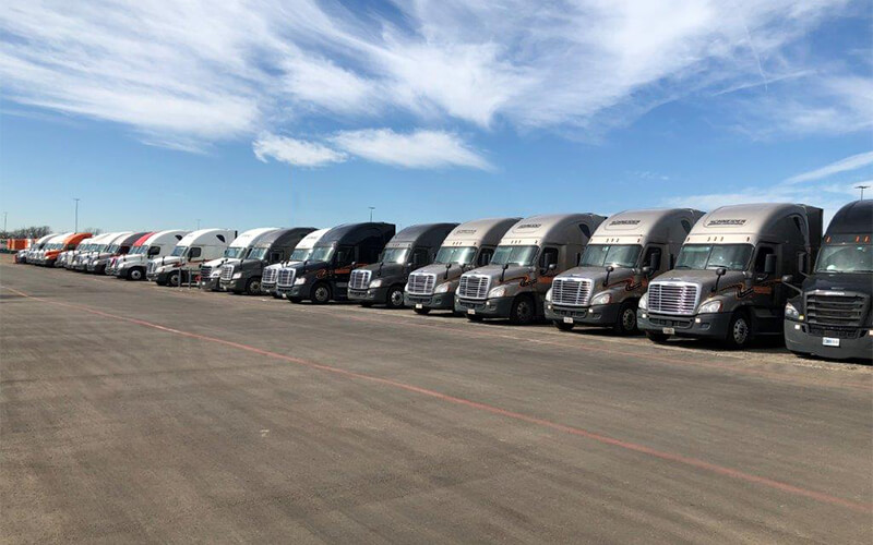 Trucks line the expanded parking area at the new Dallas facility.