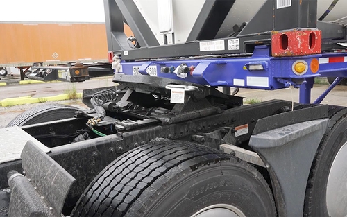 A close up of a semi-truck's coupling system.