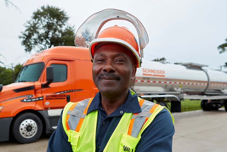 A Schneider Tanker driver wearing protective gear 