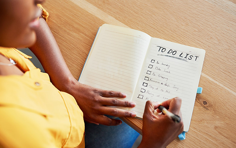 A lined notebook with a to-do checklist.