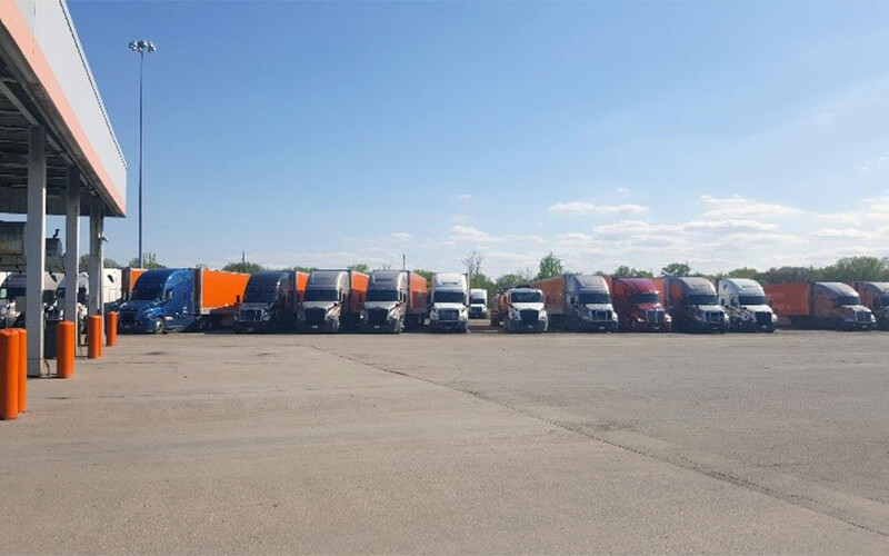 A line of Schneider trucks line the lot at the Gary facility.