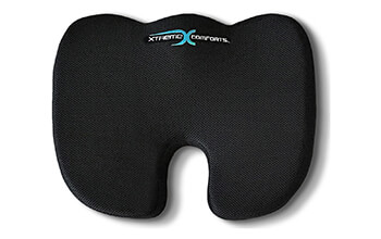 The Xtrreme Comfort Coccyx Seat Cushion is a black, U-shaped cushion that is shaped to comfortably cushion the user’s bottom.