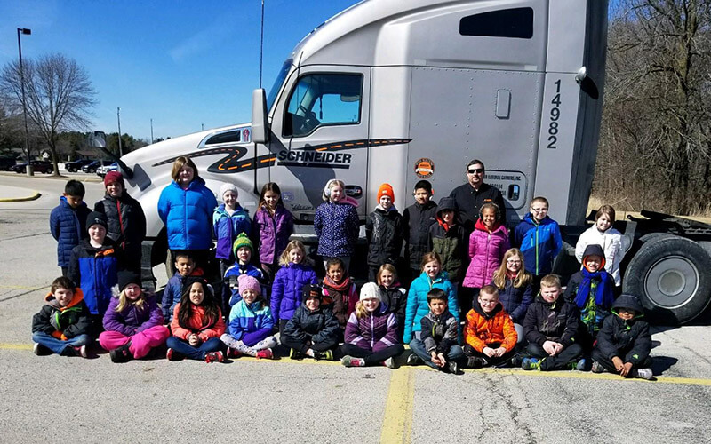 Reedsville Elementary class posing in front of Rod's semi-truck