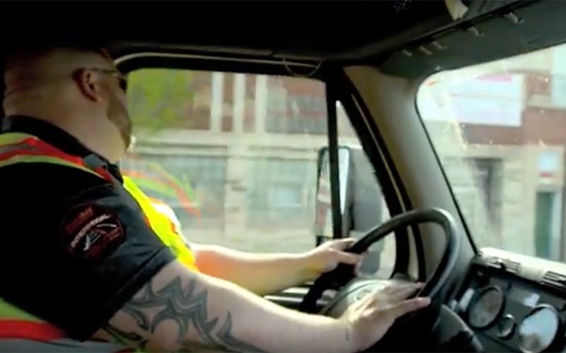 A frustrated driver dealing with road rage sits at the wheel of his truck.